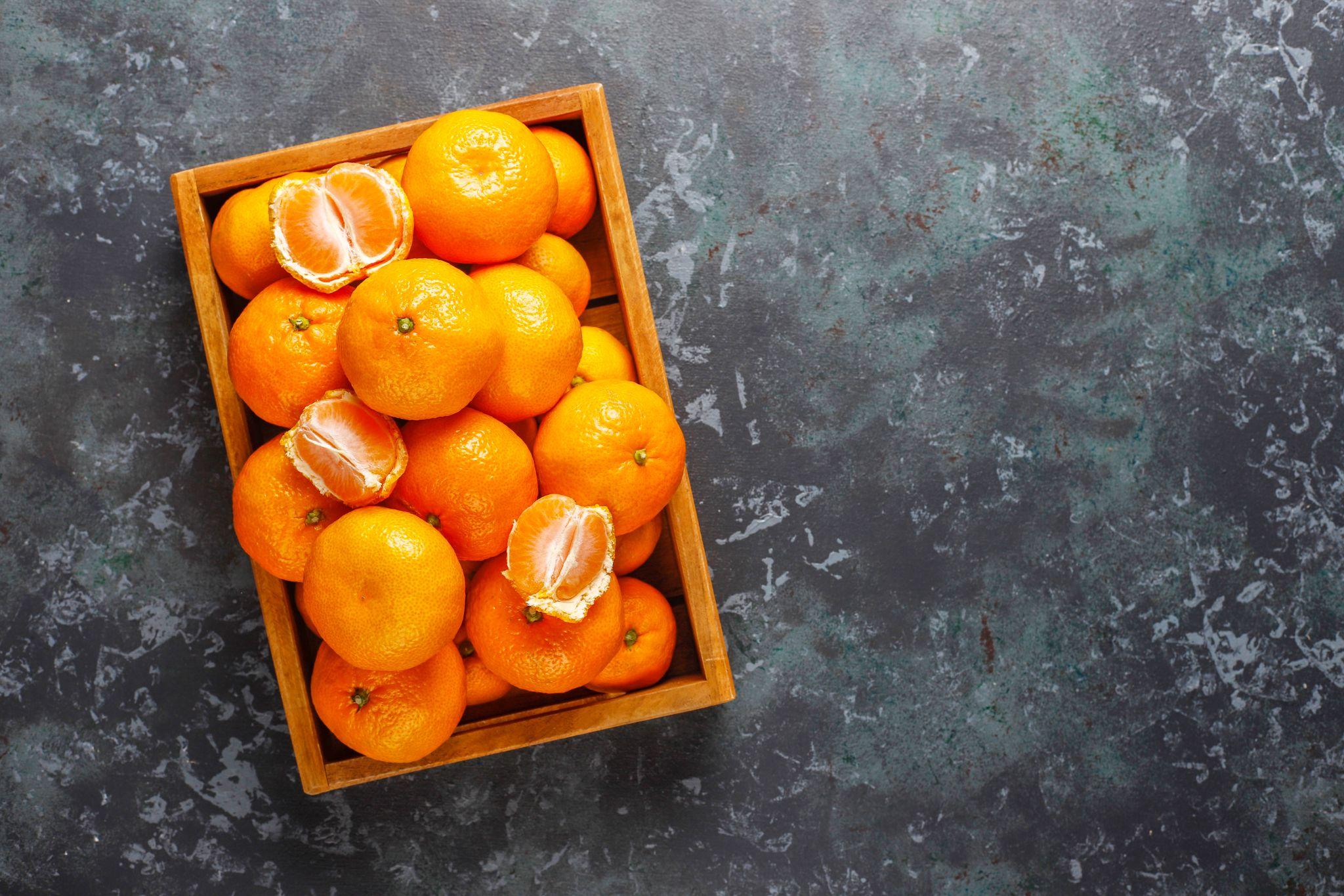 Clementines packed in a wooden crate